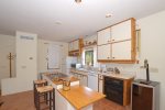 The kitchen is fully-equipped with all the appliances and amenities needed